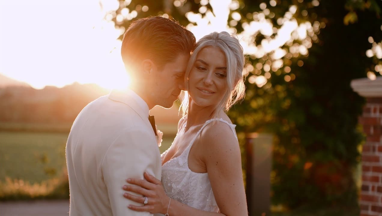 Sophie and Alex in golden-hour sunlight at Sant Ffraed House